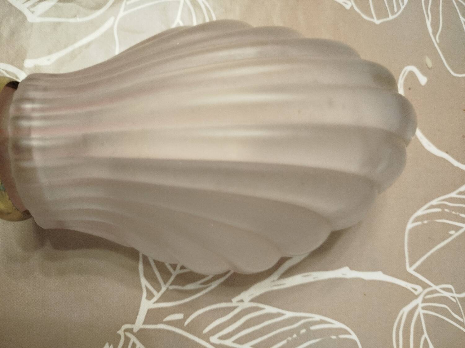 Art Deco wall sconce in frosted pink glass with a seashell design
