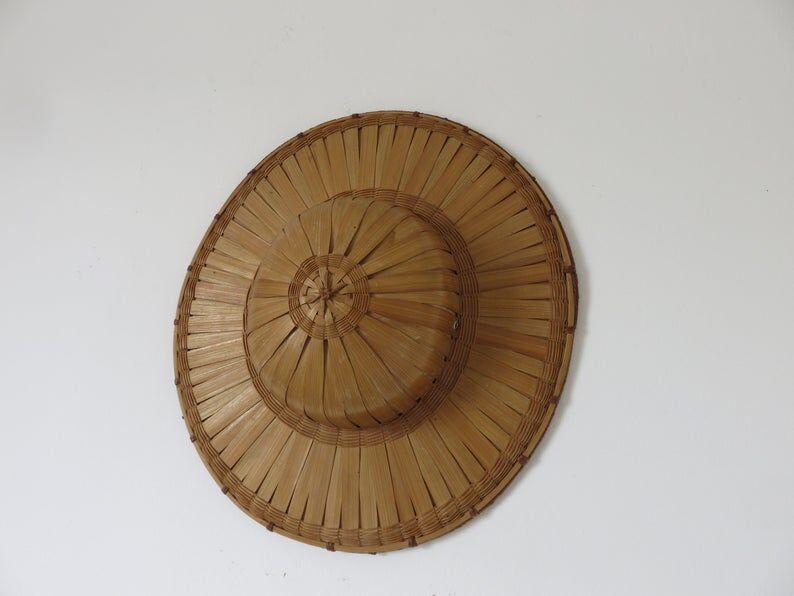 Colonial hat in bamboo and braided rattan, wall decoration