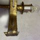 Spanish brutalist wall light in gilded wrought iron.