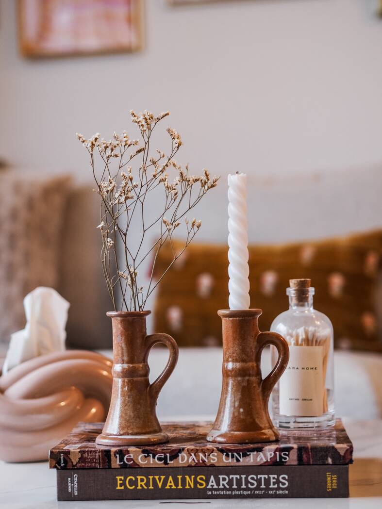 Set of two terracotta candle holders.