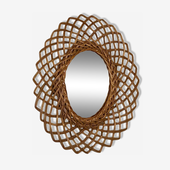 Sun mirror in woven rattan. 1960.