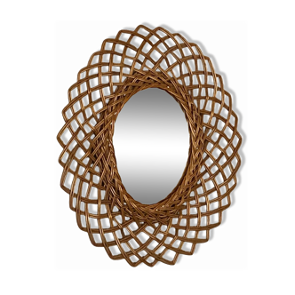 Sun mirror in woven rattan. 1960.