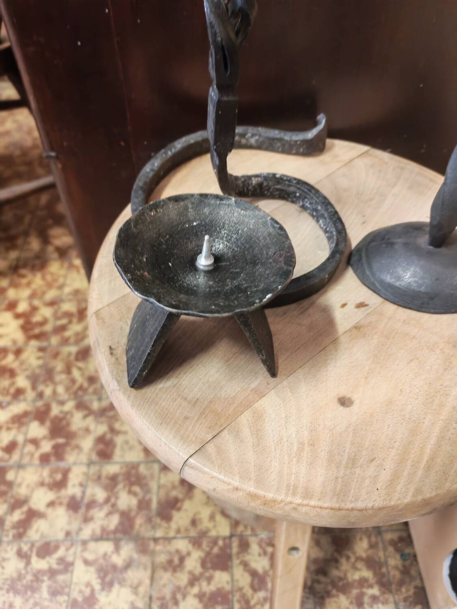 Set of 3 candlesticks and a candle holder in wrought iron.
