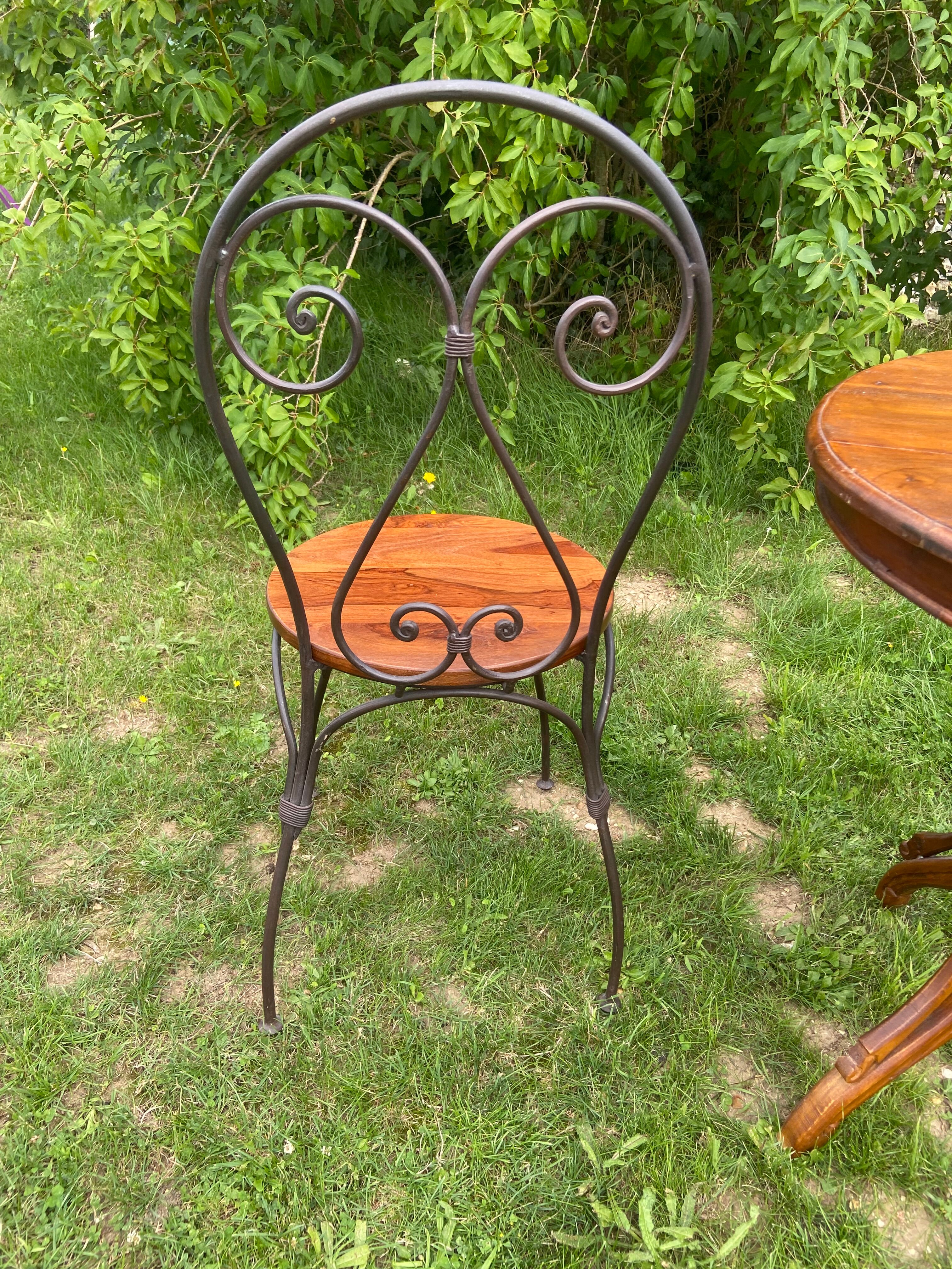 Round table and wrought iron chair