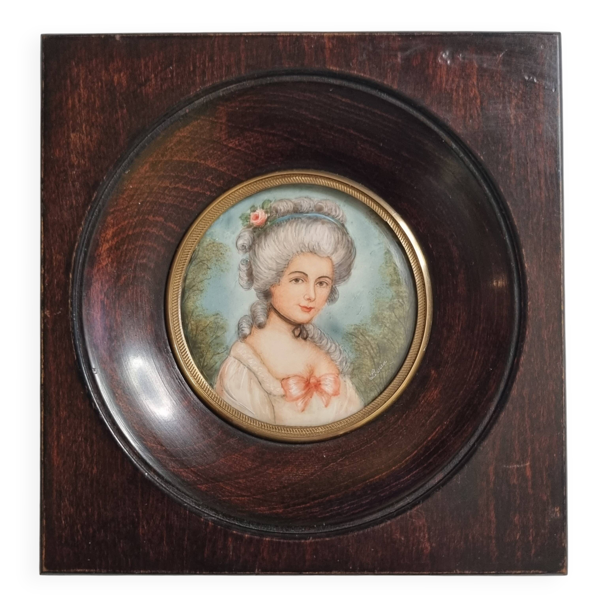 Miniature portrait of a woman in the style of Marie Antoinette, signed Lucia, 12 x 12 cm.