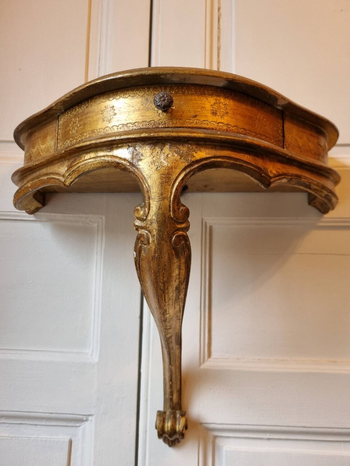 Mid-19th century wall console in wood and gilded stucco