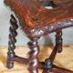 Antique stool in turned and carved solid wood