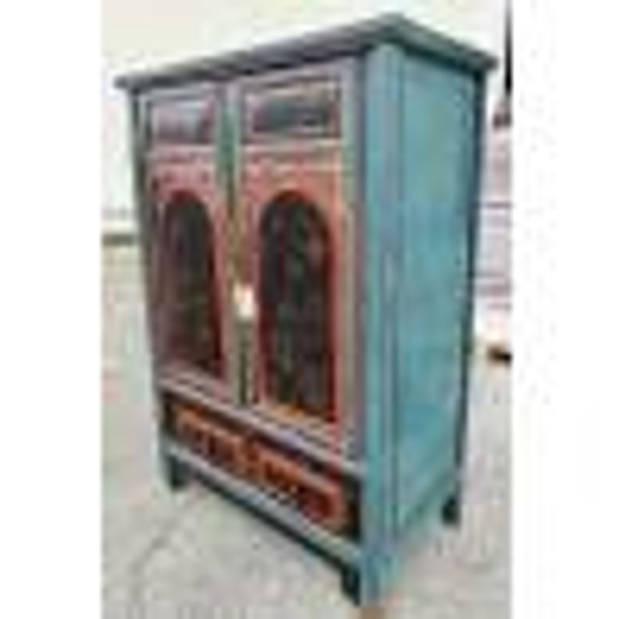 Restored antique Vietnamese wardrobe with care.