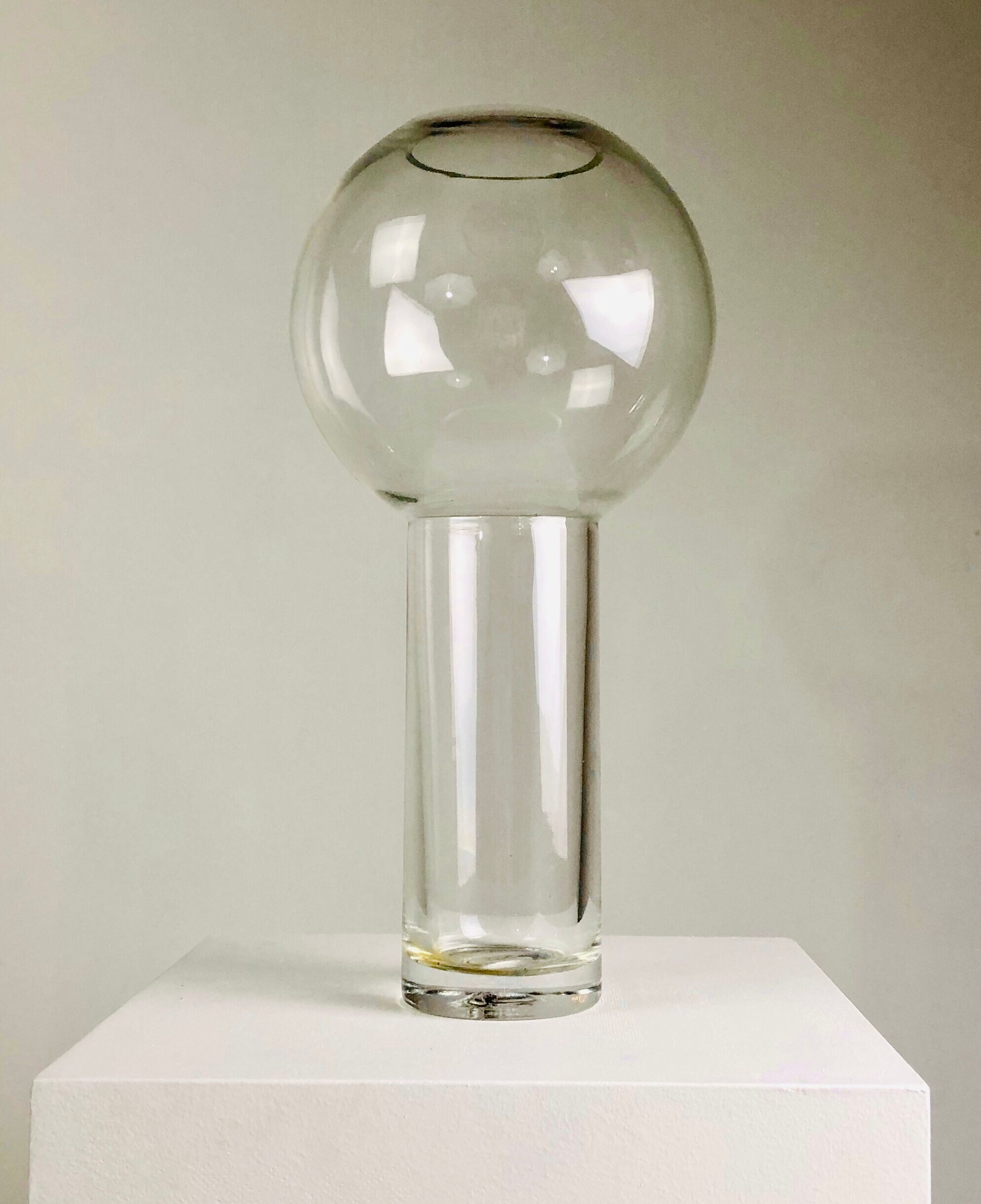 A modernist vase in clear glass.
