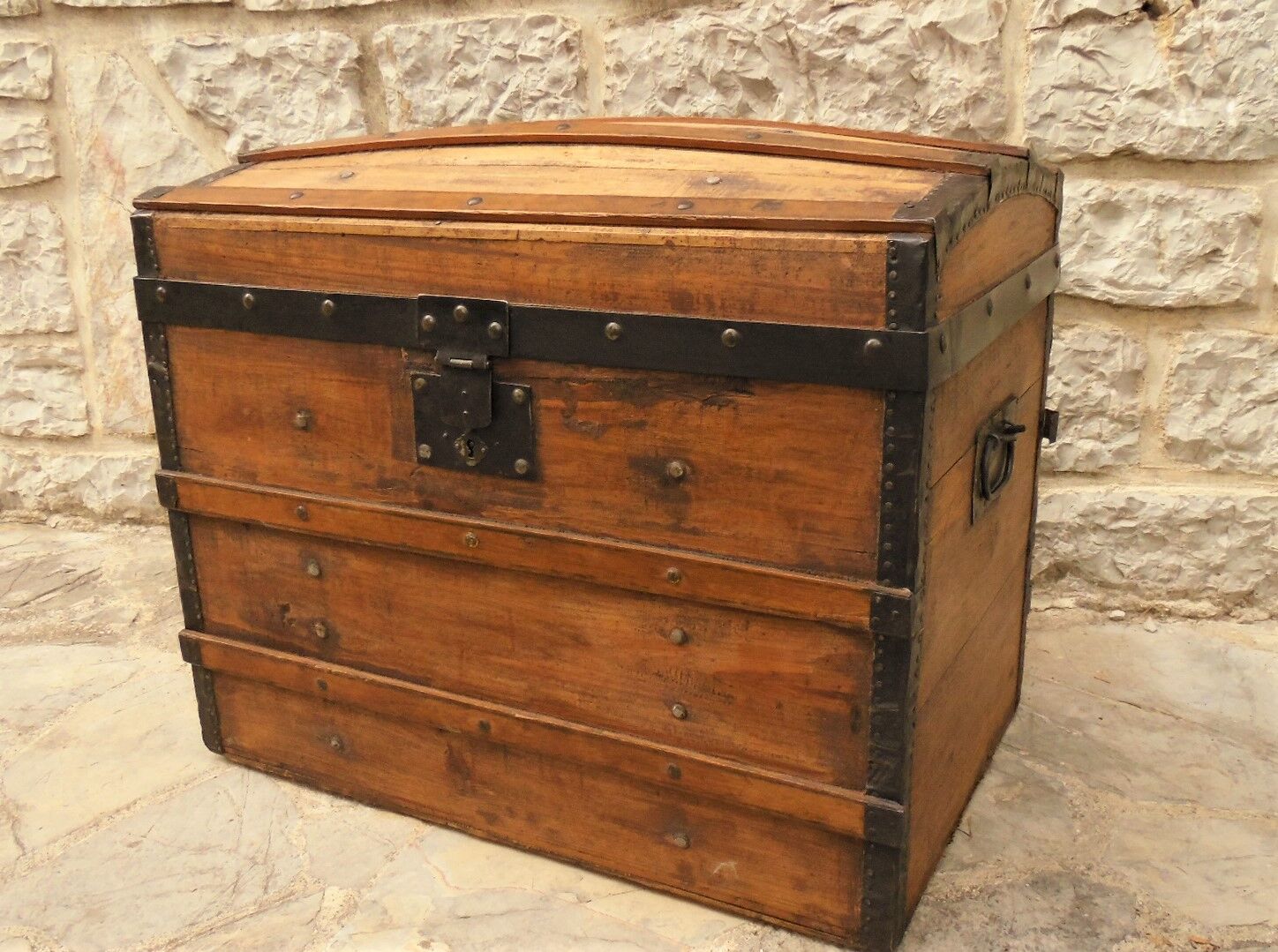 Ancient travel trunk, bulging wooden chest