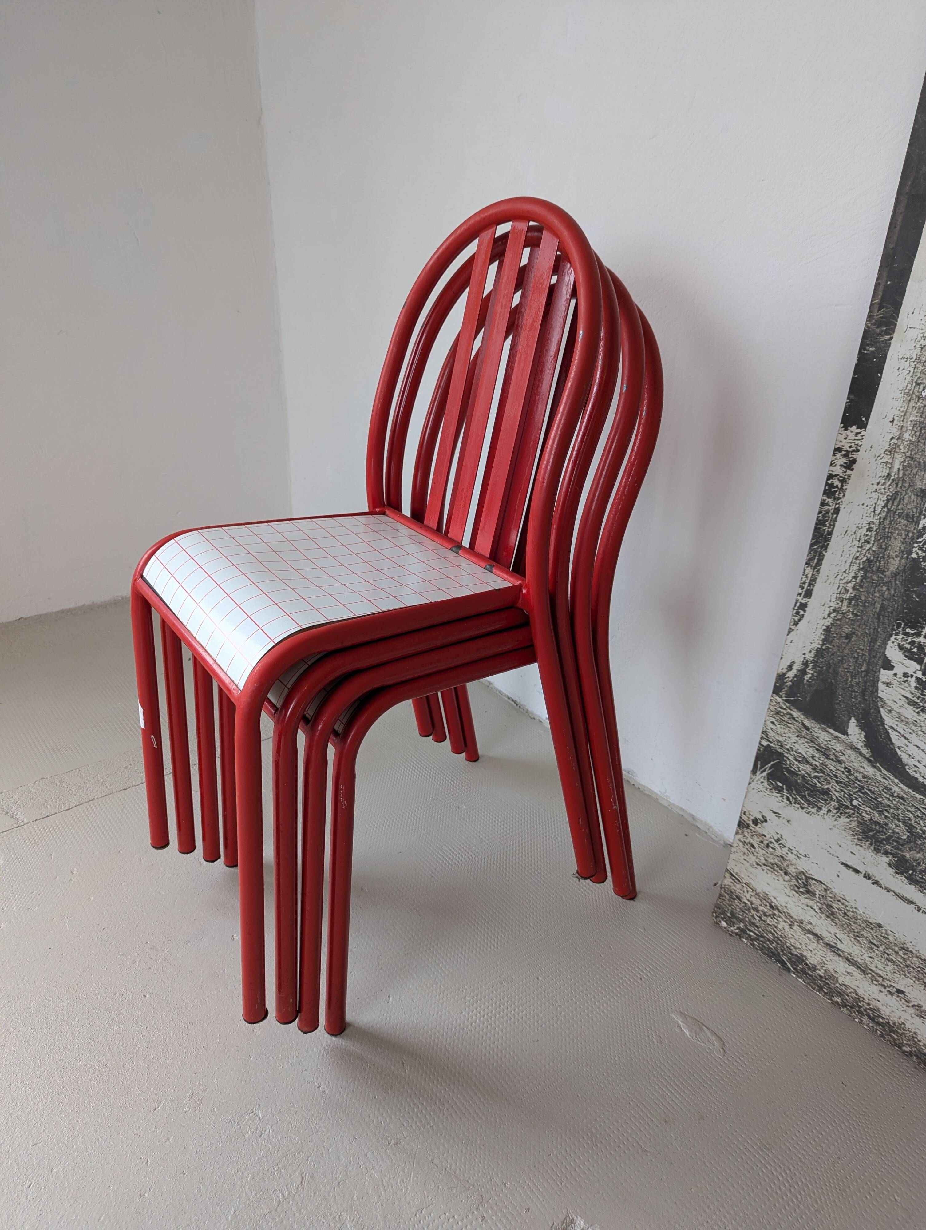 Set of 4 modernist red metal chairs