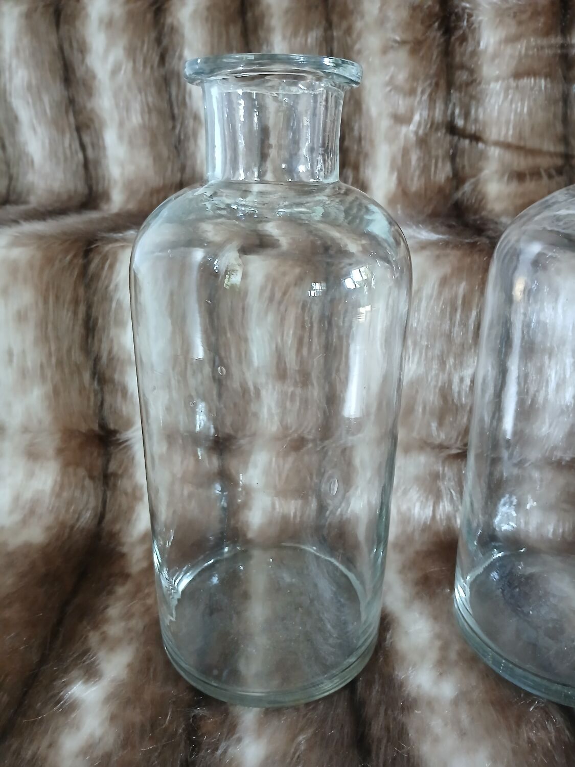2 large antique transparent glass bottles