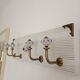 Wall-mounted coat rack 50 cm – 4 hooks and decorative central button