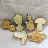 Lot of slurry hooks in the shape of plants and animals