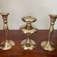 Three vintage brass candle holders