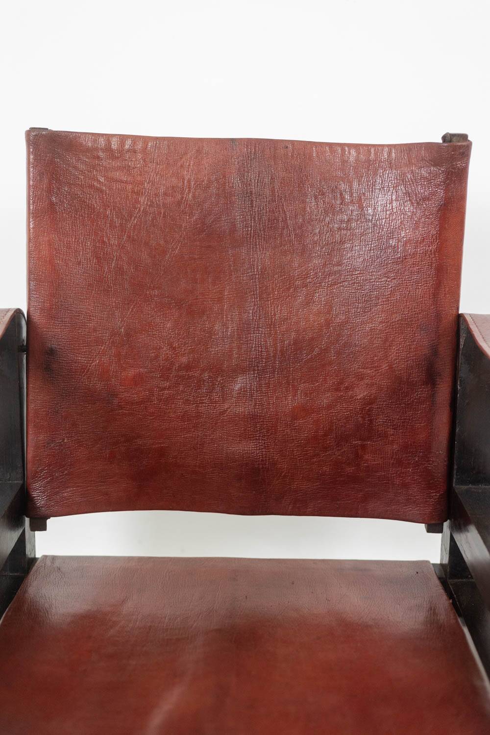 “Safari” armchair in wood and cognac leather. 1960s/70s.
