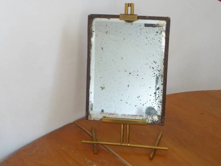 Table mirror on a brass easel