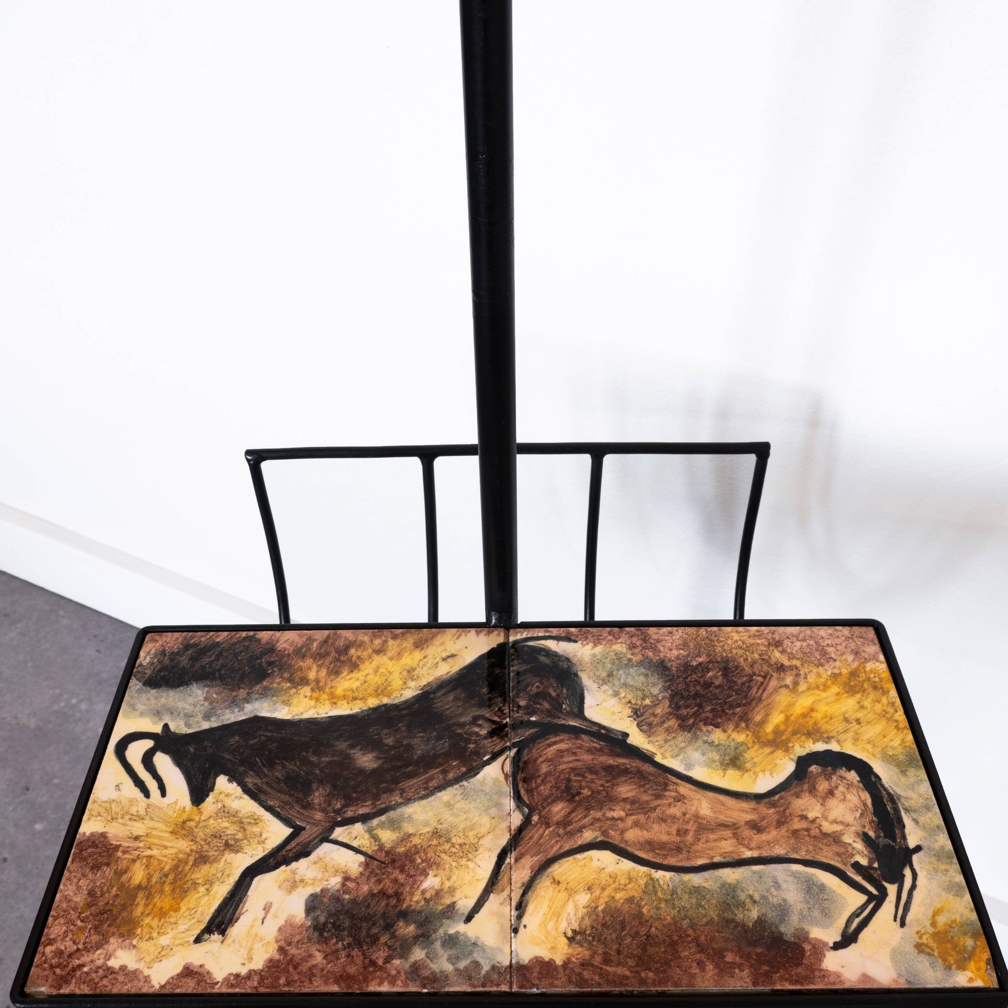 Black metal magazine rack floor lamp with ceramic shelf