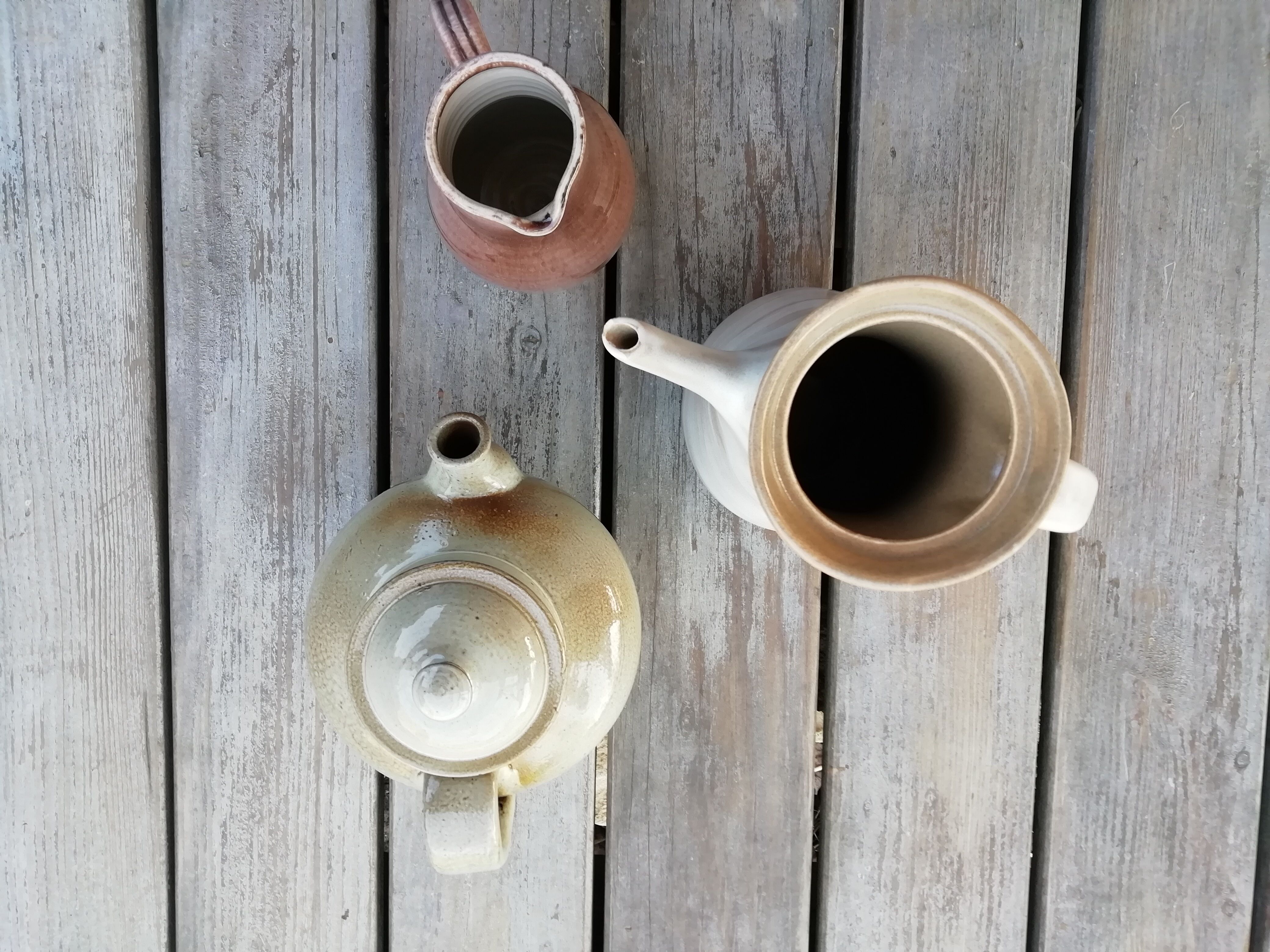 Trio of artisan sandstone teapots