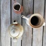 Trio of artisan sandstone teapots