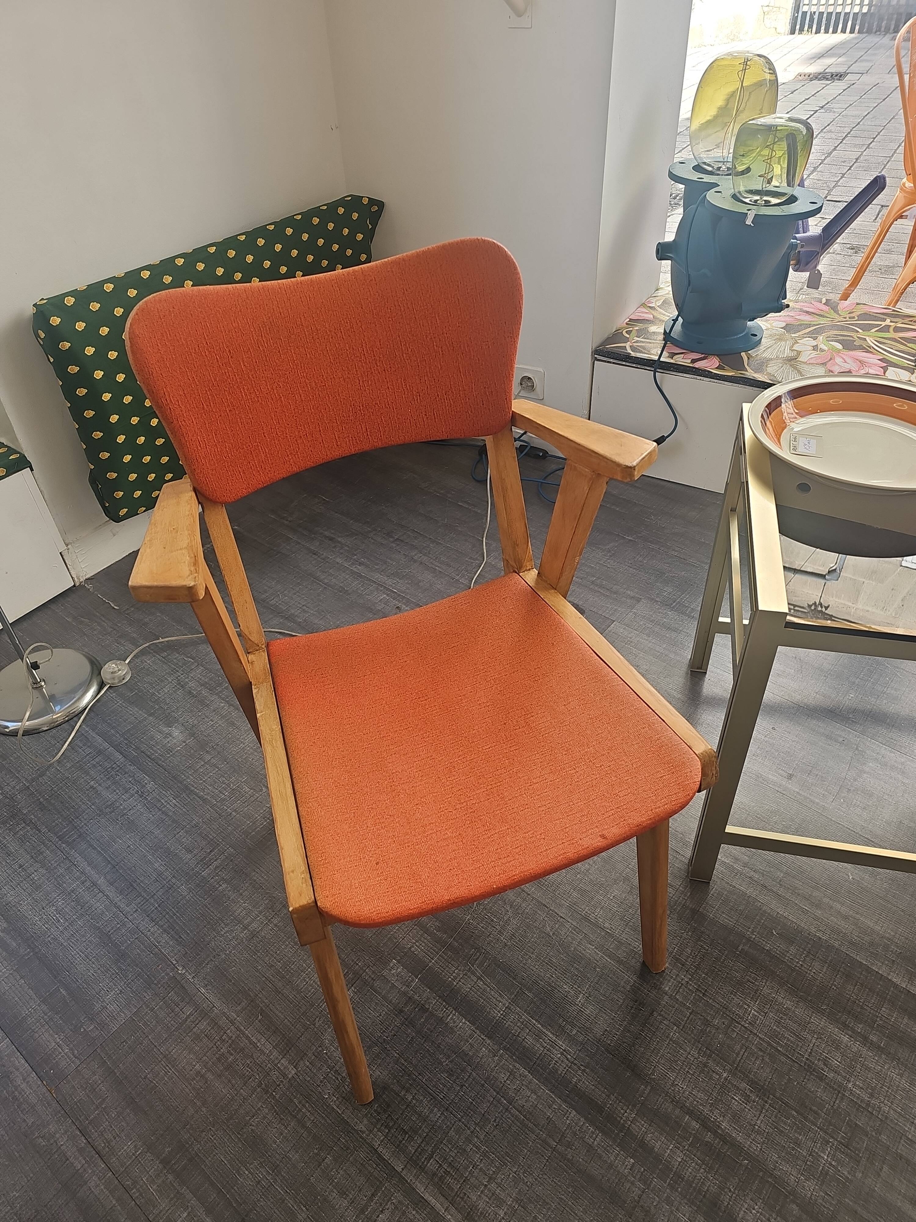Modernist armchair in wood and orange fabric