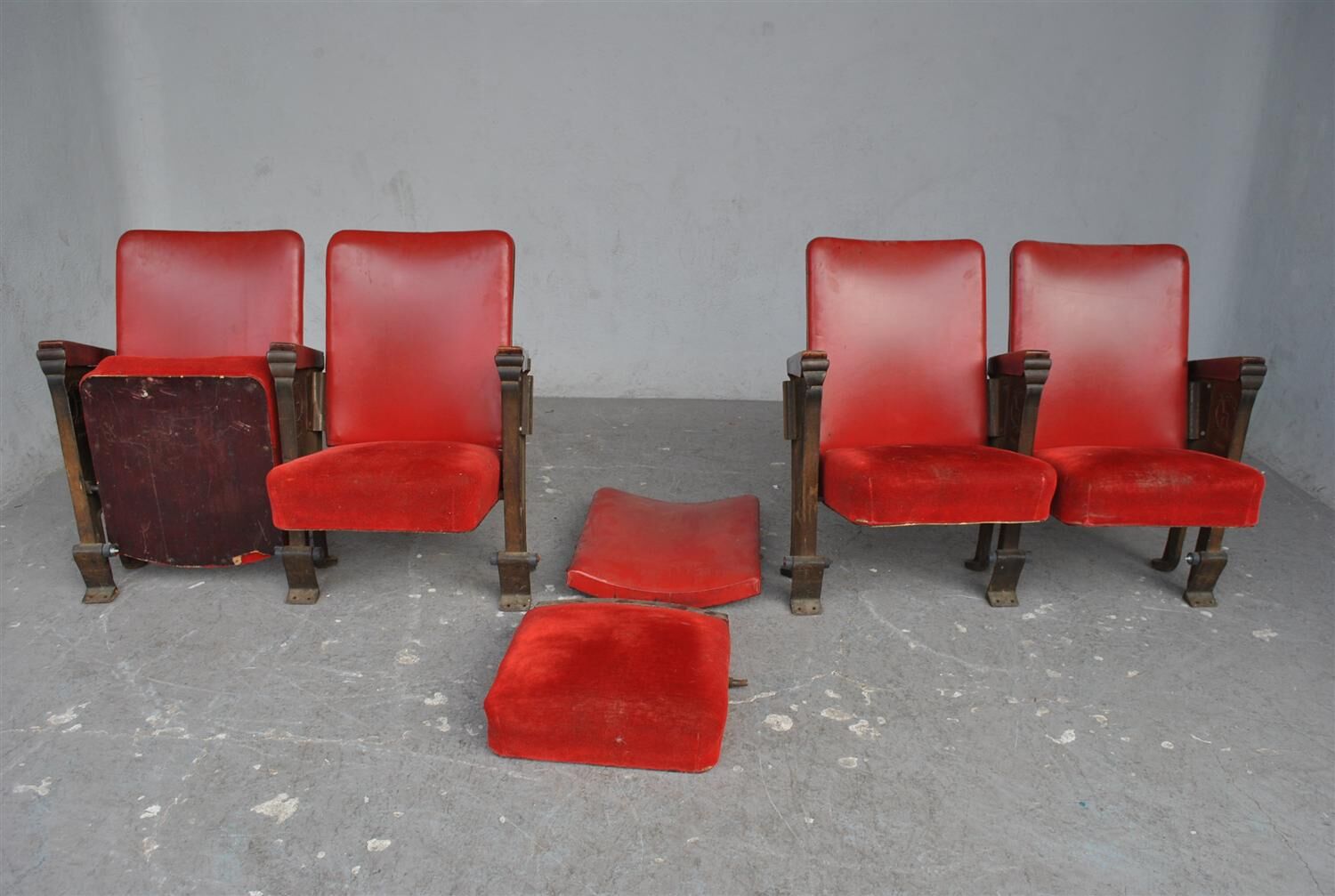 Series of 5 red skai and patinated cast Theater chairs