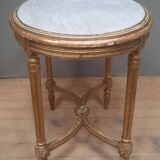 Oval coffee table in gilded wood in the Louis XVI style.