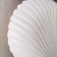 White ceramic dish shaped like 80s shells