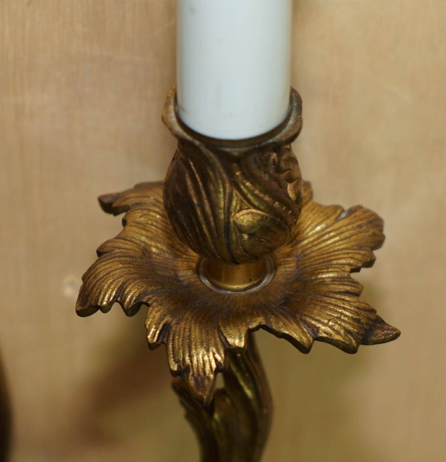 Pair of antique French wall sconces, gilded and bronzed, from the 1920s.