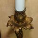 Pair of antique French wall sconces, gilded and bronzed, from the 1920s.
