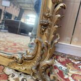 Napoleon III mirror in wood and gilded stucco with gold leaf.