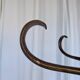 Vintage bentwood coat rack in Thonet style / Dark wood coat rack with shadow.