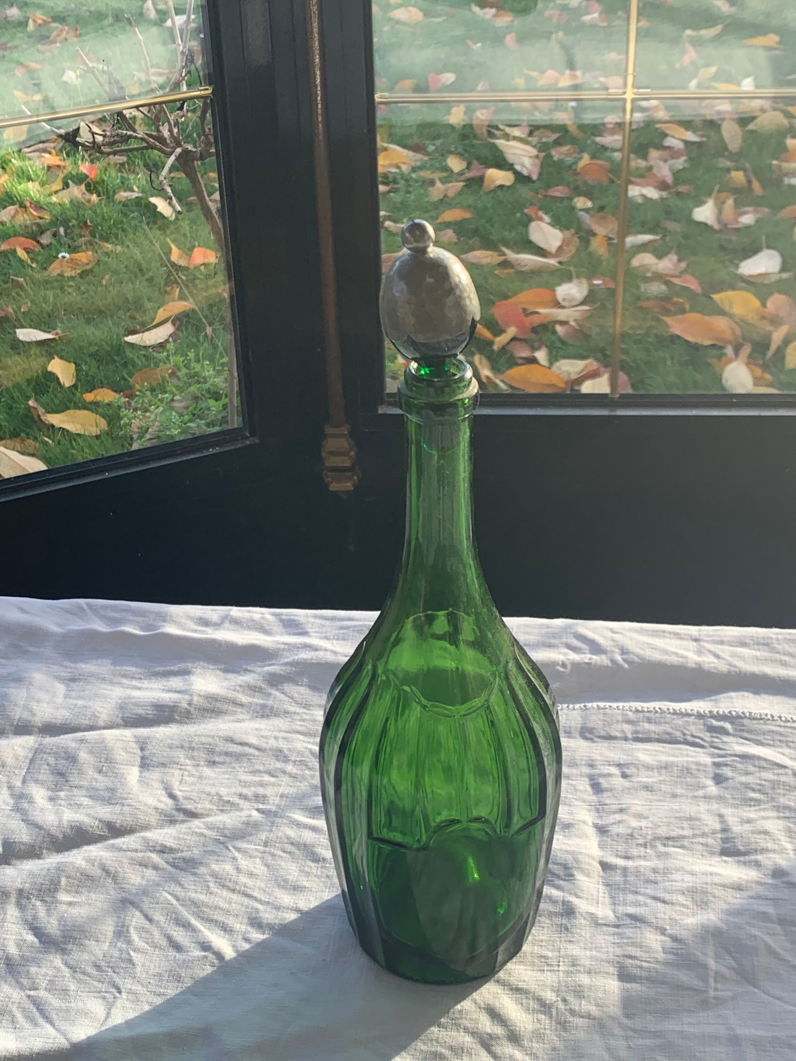 Bottle, green glass bottle green stopper and antique pewter
