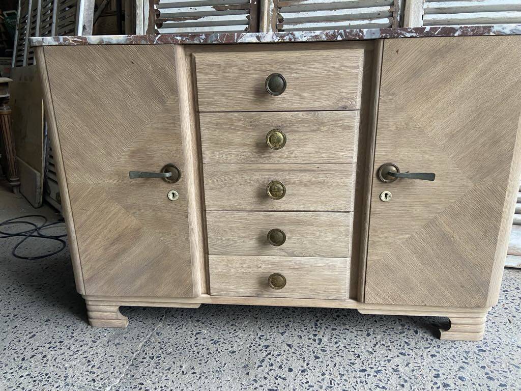 Raw wood chest of drawers with marble top