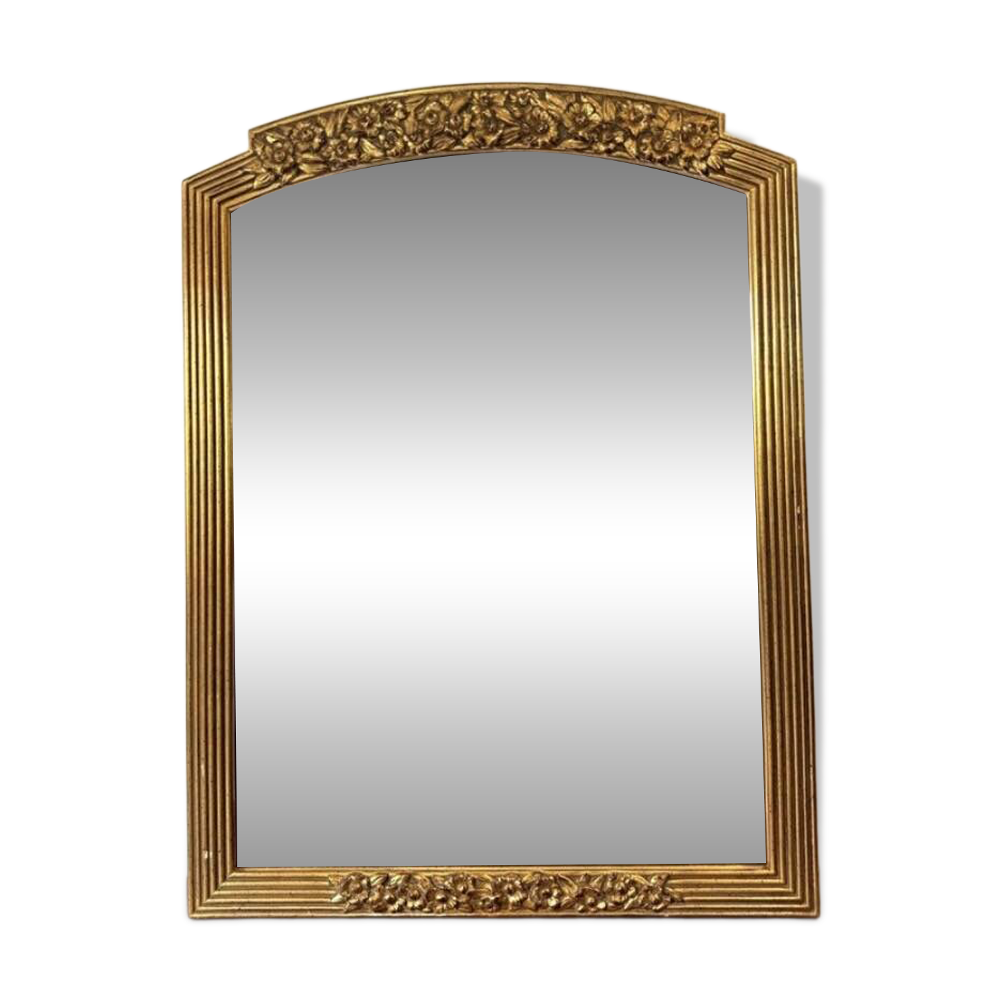 Large vintage gold mirror in Louis XVI style – fluted frame and floral decoration.