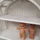White lacquered rattan bookcase