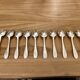 Set of 10 small silver metal spoons