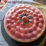Glazed ceramic dessert plate with strawberry design.