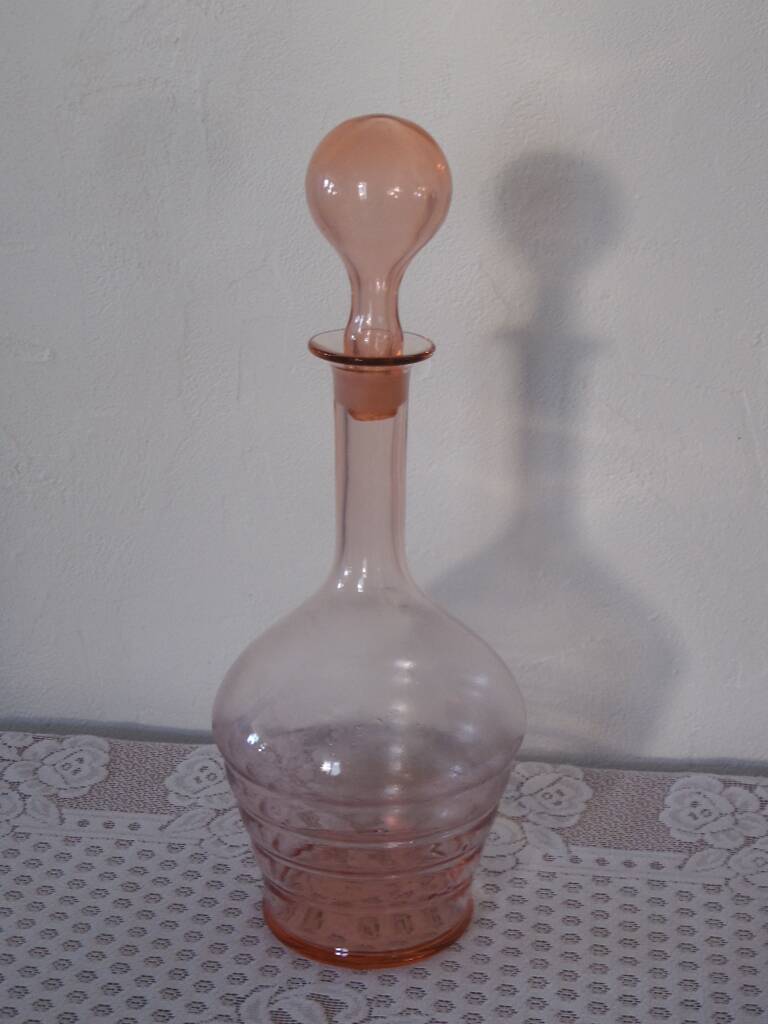Pink transparent glass carafe with bubble cap