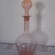 Pink transparent glass carafe with bubble cap
