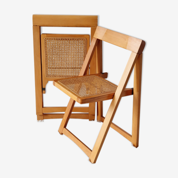 Pair of canned folding chairs.