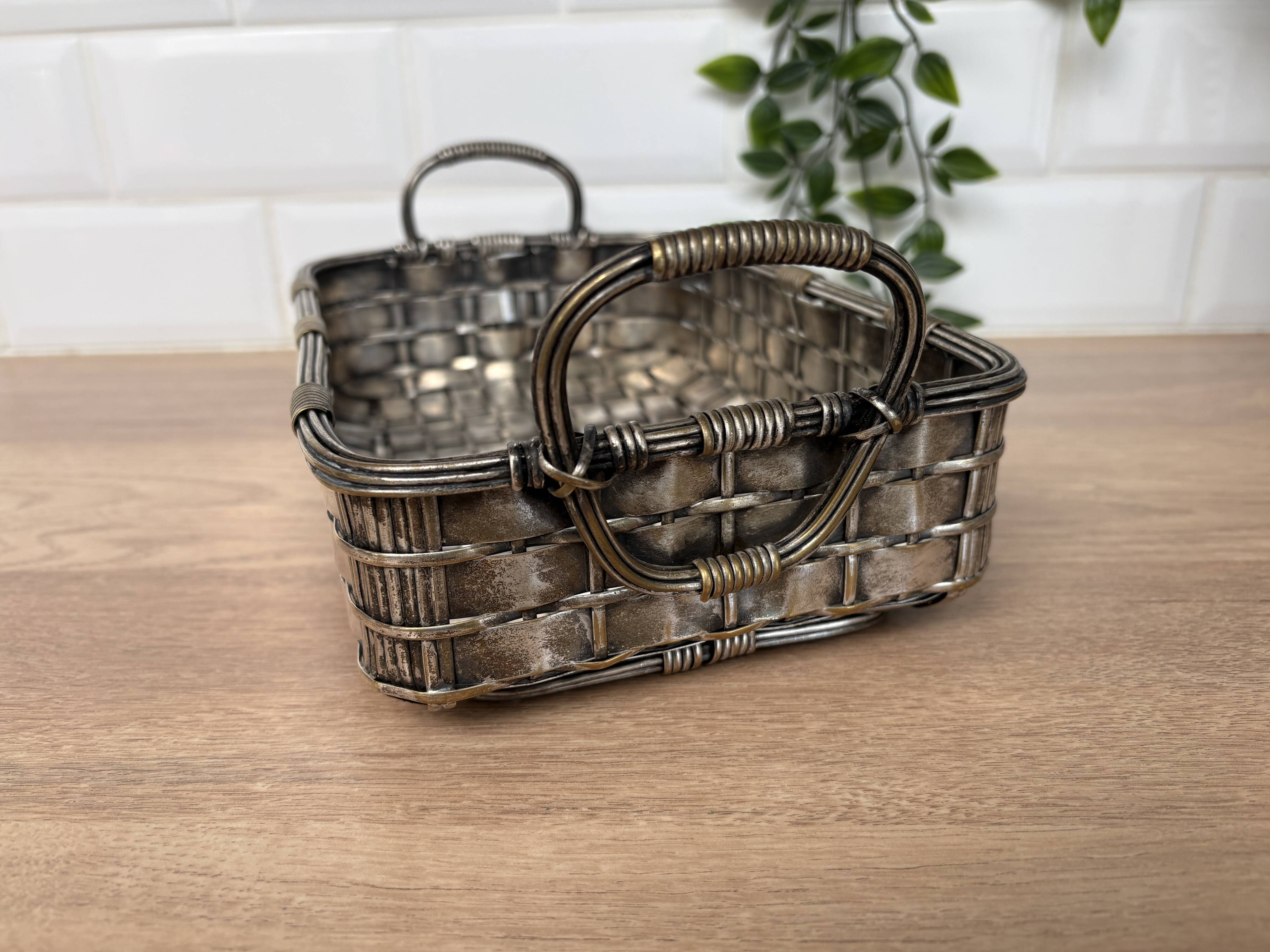 Woven silver-plated metal basket.