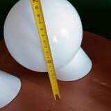 Two opaline glass globe wall lights