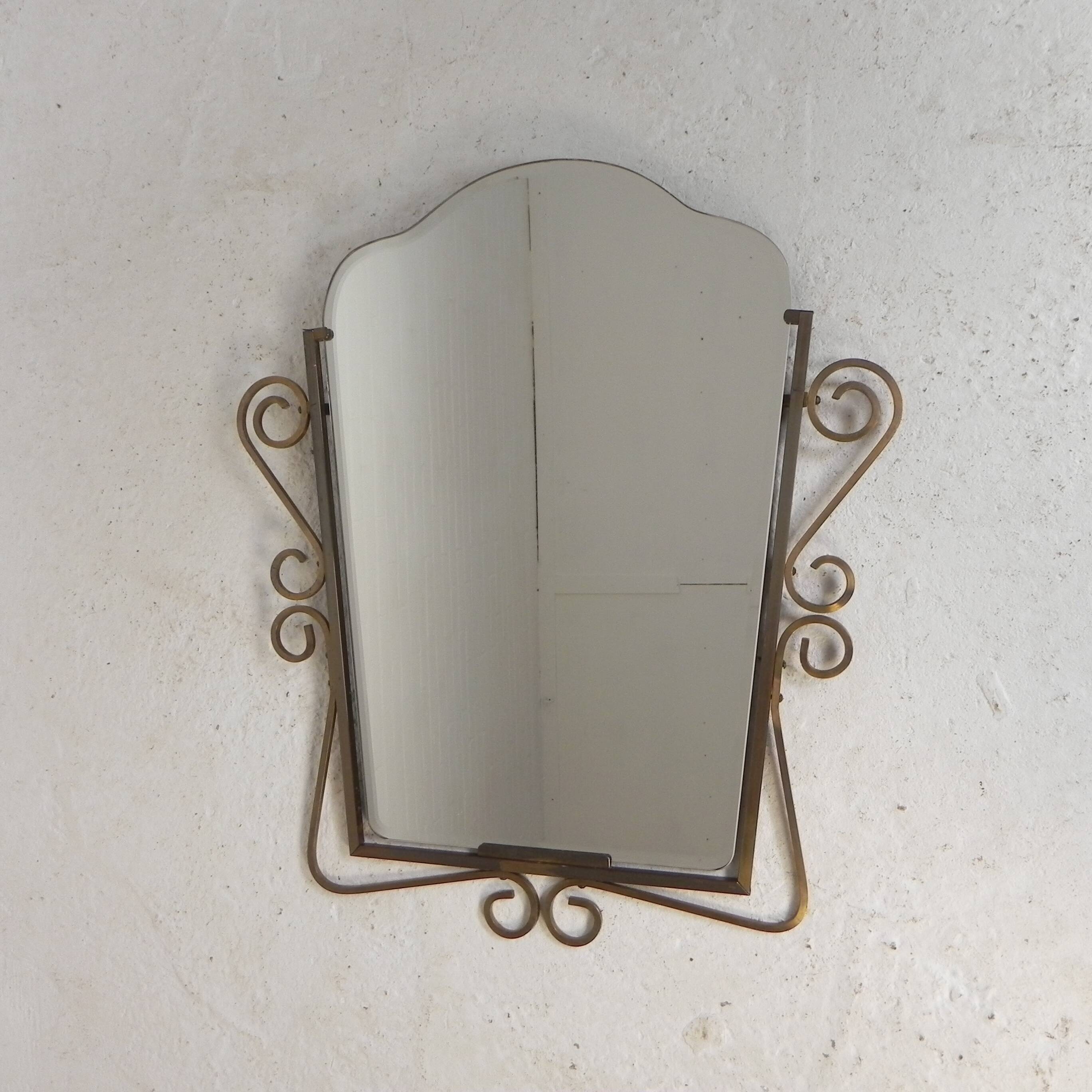 Vintage faceted mirror in a brass frame, 1950s.