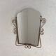 Vintage faceted mirror in a brass frame, 1950s.