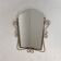 Vintage faceted mirror in a brass frame, 1950s.