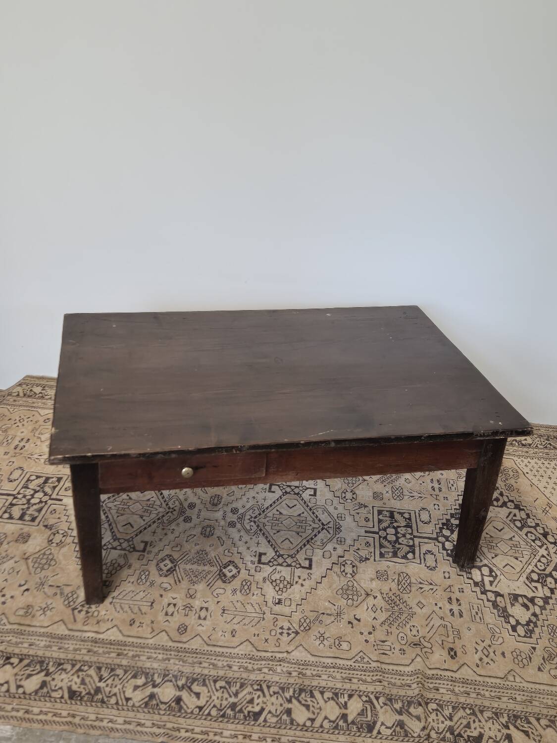 Rustic farmhouse coffee table from the 1900s with two drawers.