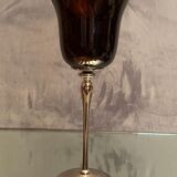 Tinted glass photophore on high metal foot with silver patina