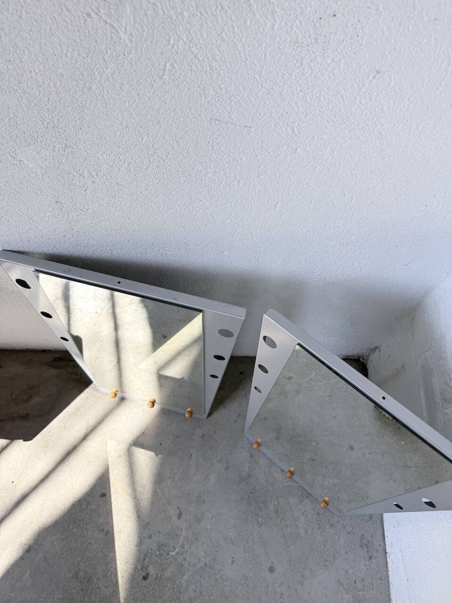 Pair of "Memphis" mirrors from the 80s in chrome and wood.