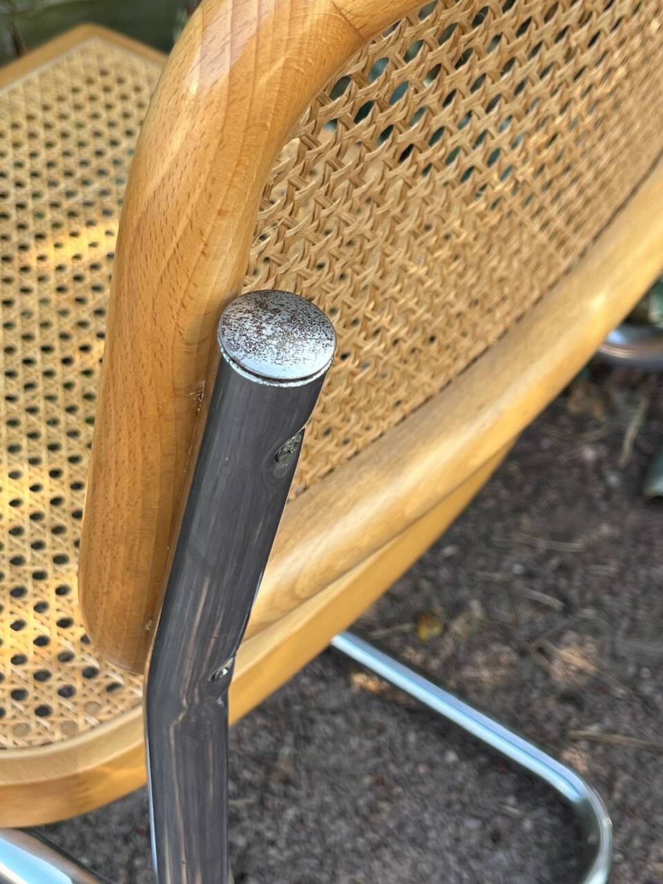 Wooden chair with caning in the style of Marcel Breuer.